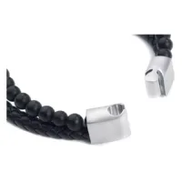 Wildcat Armband aus Leder und Stahl Schwarzes Lederarmband mit matten Kugeln und Stahlverschluss auf weißem Hintergrund