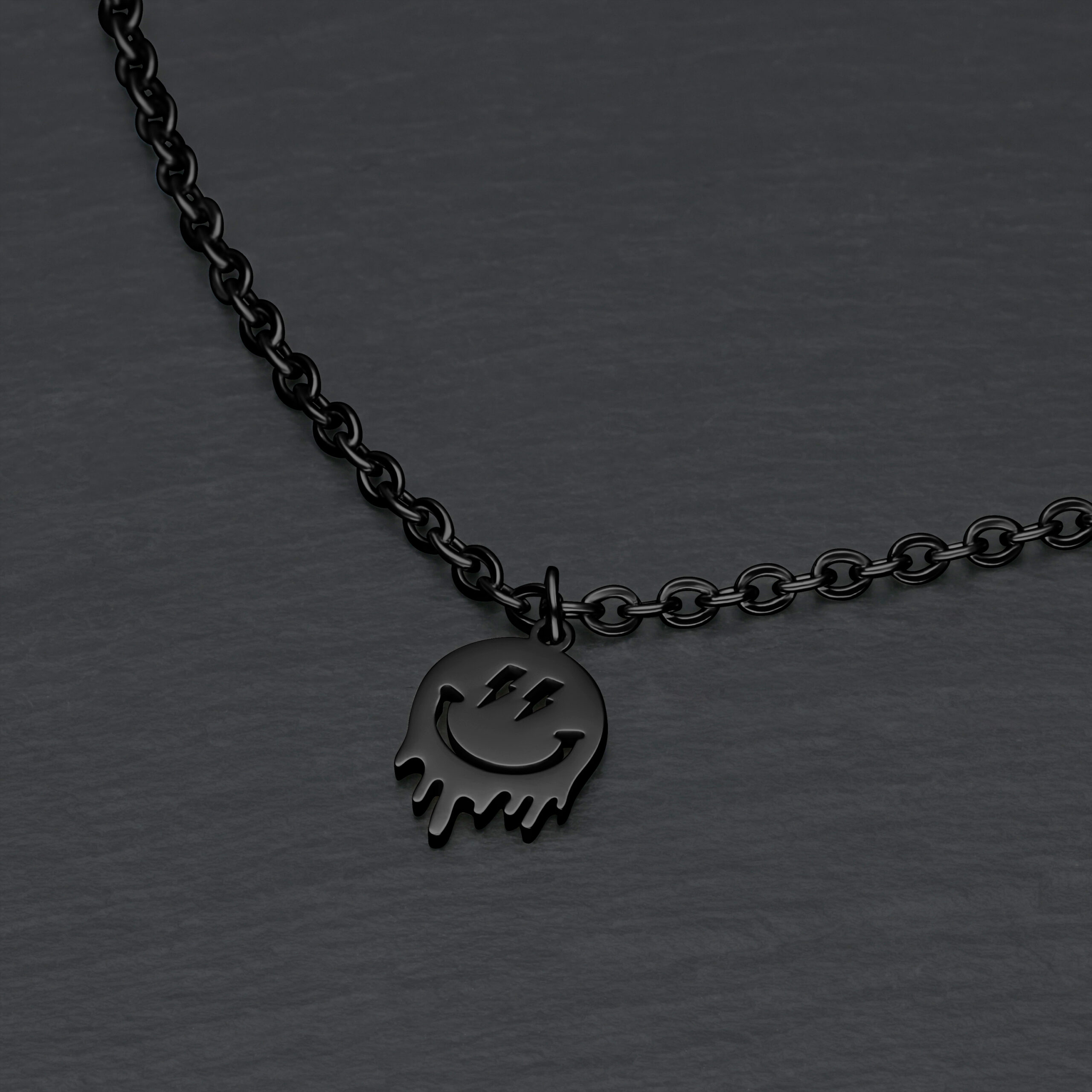 Schwarzes Smiley-Armband aus Metall Schwarzes Metallarmband mit Smiley-Anhänger auf grauem Hintergrund