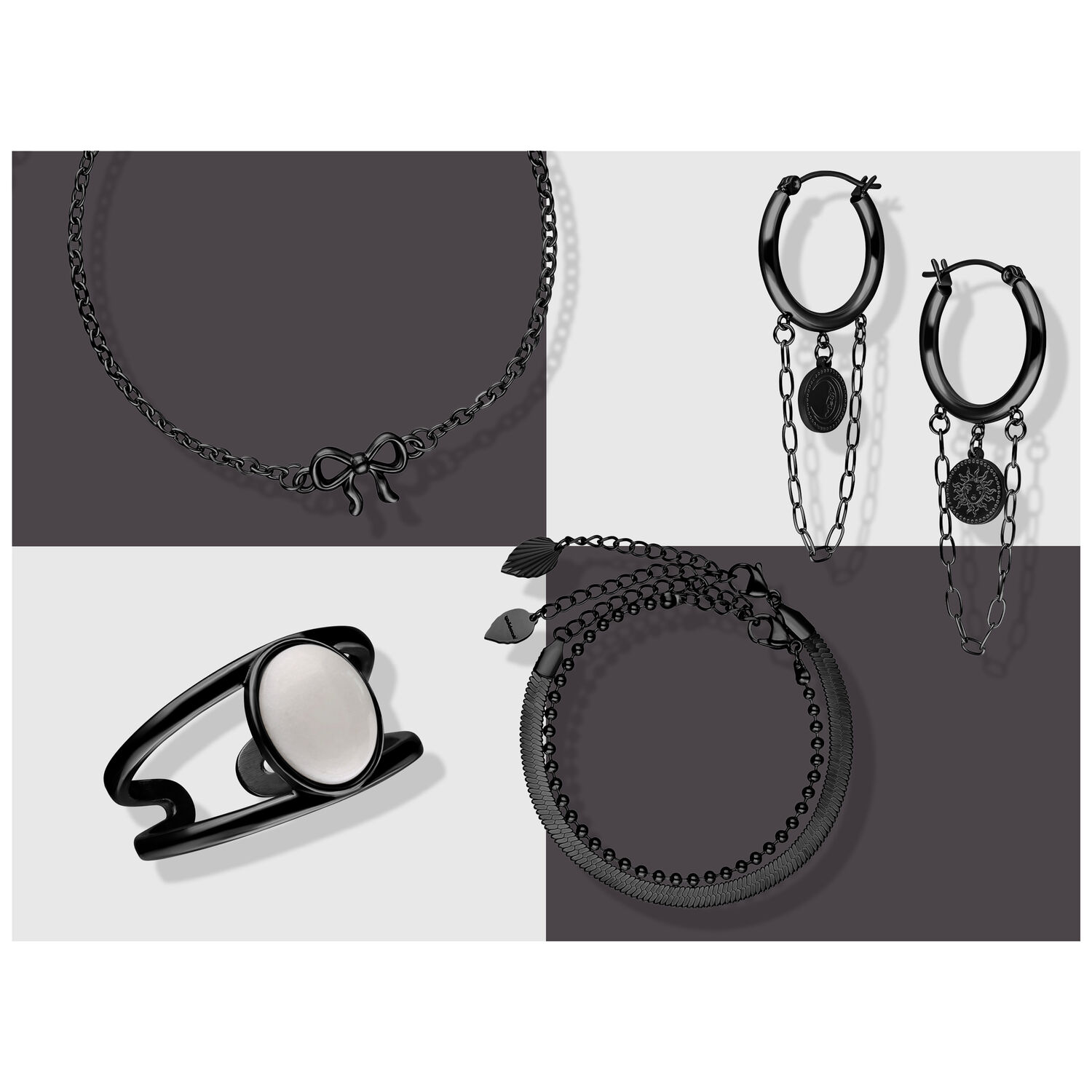 Schwarzer Schmuckset mit Kette, Ringen und Ohrringen auf grauem Hintergrund