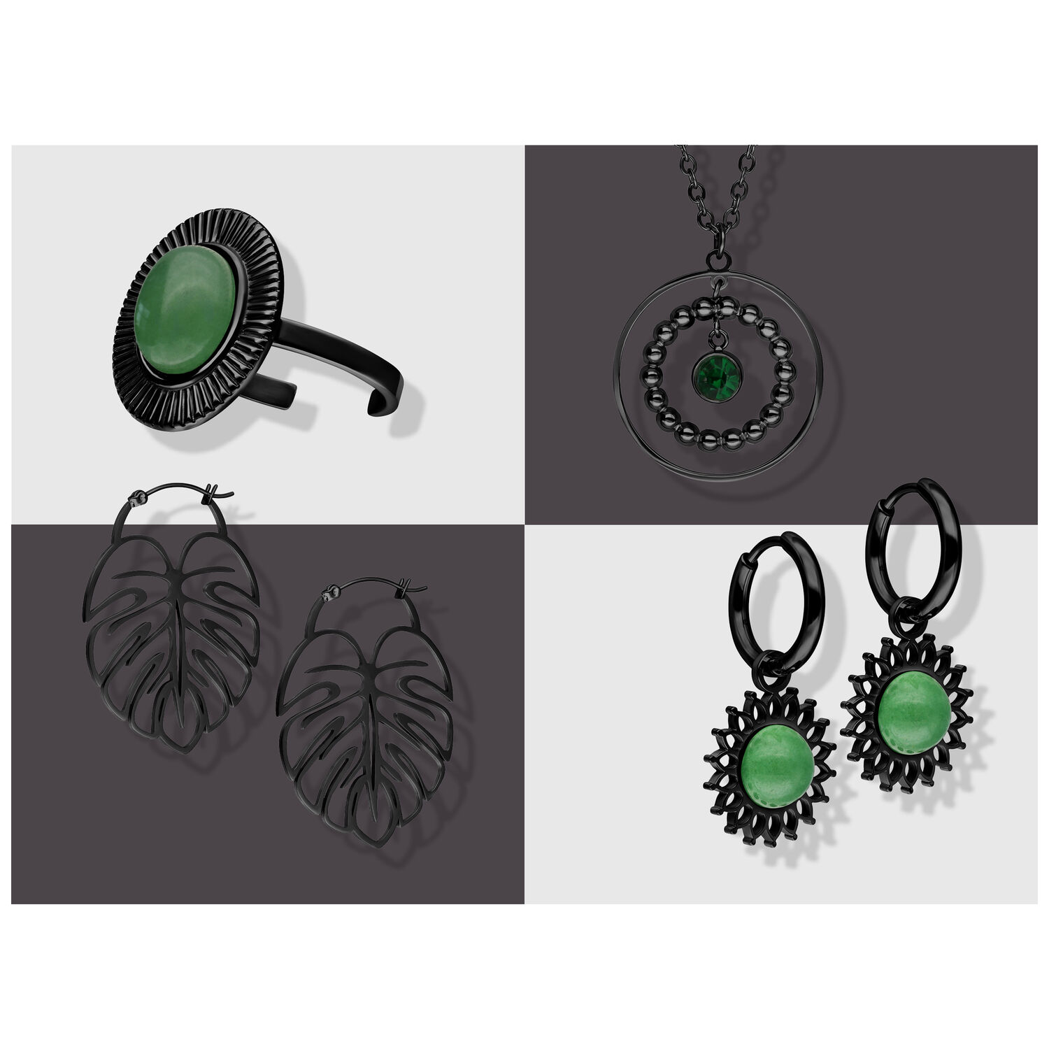 Schwarze Schmuckstücke auf grauem Hintergrund, inkl. grüner Akzente