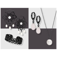 Schwarze Ohrringe, Halskette und Armband aus Chirurgenstahl 316L auf grauem Hintergrund