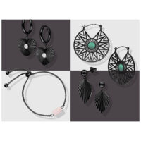 Schwarze Ohrringe und Armband auf zweifarbigem Hintergrund