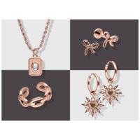 Roségoldenes Schmuckset mit Kette, Ohrringen und Armband auf zweifarbigem Hintergrund