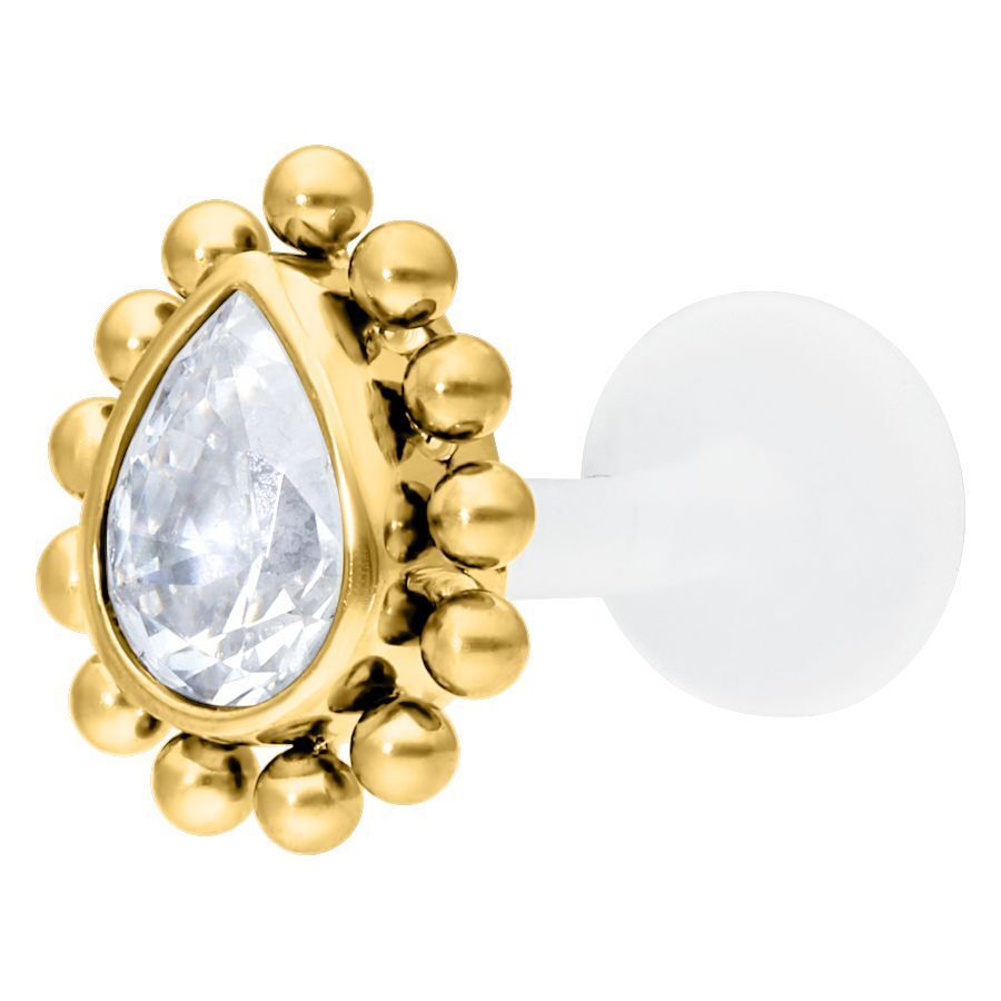 Kultainen labret kristallinkirkkaalla pisarakristallilla valkoisella taustalla