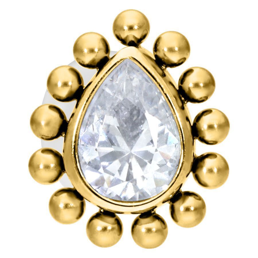 Kultainen labret-lävistys kristallinkirkkaalla tipalla valkoisella taustalla