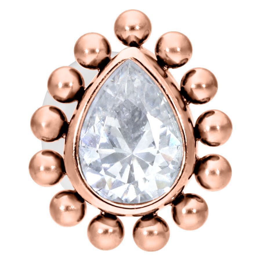 Ruusukultainen labret kristallinkirkkaalla pisaralla valkoisella taustalla