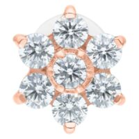 Labret, jossa ruusukultainen kukka kristalleista valkoisella taustalla