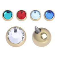 Goldener Aufsatz für Piercings mit Zirkonkristallen in Blau, Rot und Weiß