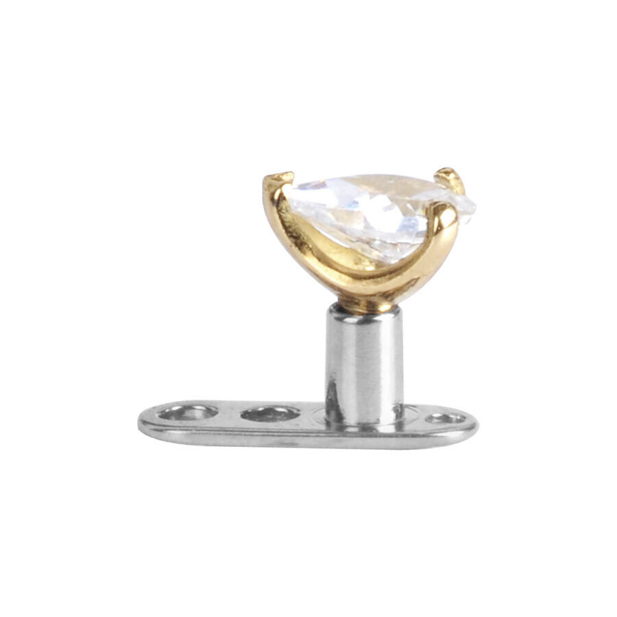 Kultainen lävistysosa kristallilla valkoisella taustalla