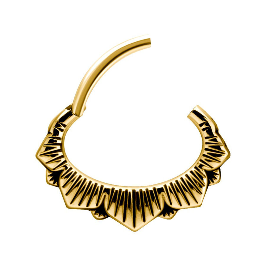 Kultainen septum clicker kukkakuviolla valkoisella taustalla