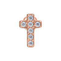 Rosékultainen korvatappi ristimuodossa, jossa on kirkkaita kristalleja valkoisella taustalla