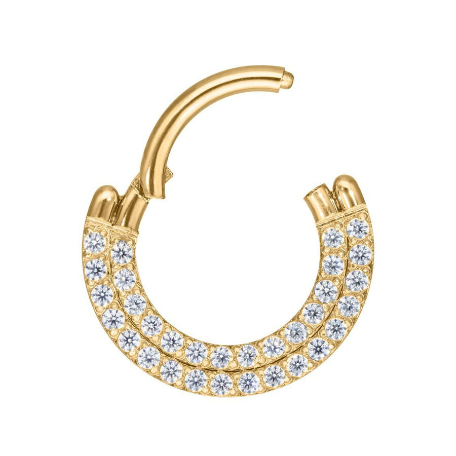 Kultainen lävistysrengas, jossa kaksi riviä kirkkaita kristalleja valkoisella taustalla