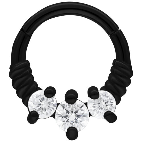 Schwarzer Septum Clicker mit drei klaren Kristallen auf weißem Hintergrund