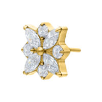 Kultainen metallilisäosa, jossa kristallinkirkkaat kivet kukkamuodossa