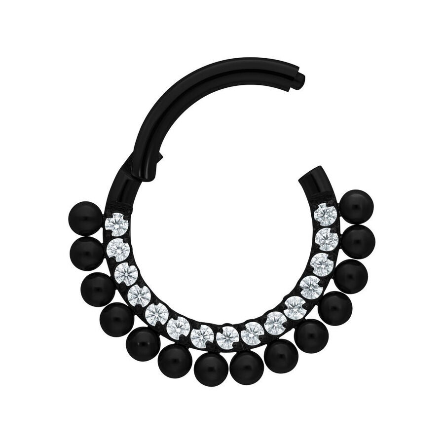 Musta lävistysrengas kirkkailla kristalleilla ja pienillä palloilla