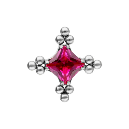 Hopeinen kärki rubiininpunaisella kristallilla ja kuplakuviolla valkoisella taustalla